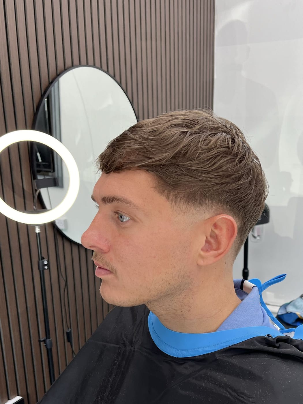 A textured crop with a low fade, freshly cut at Image Barberz